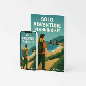 Cover of the Solo Adventure Planning Kit eBook showing a person with a backpack overlooking a scenic coastal trail, symbolizing independent travel and self-directed exploration.