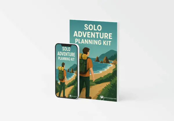 Cover of the Solo Adventure Planning Kit eBook showing a person with a backpack overlooking a scenic coastal trail, symbolizing independent travel and self-directed exploration.